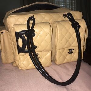 Large Chanel nude purse with black handles